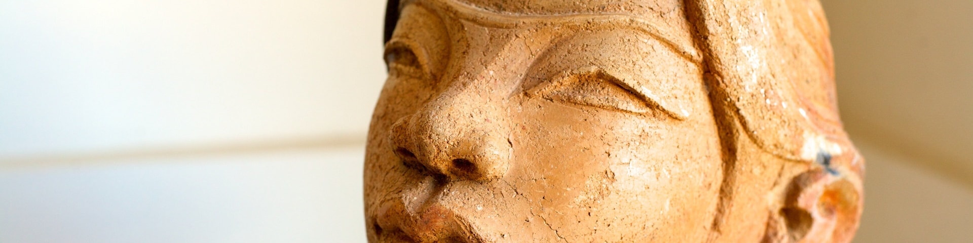 A terracotta sculpture of a human figure.