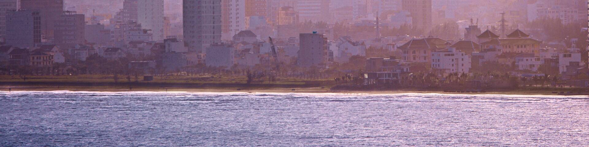 Son Tra Mountain showing a coastal town and mist or fog