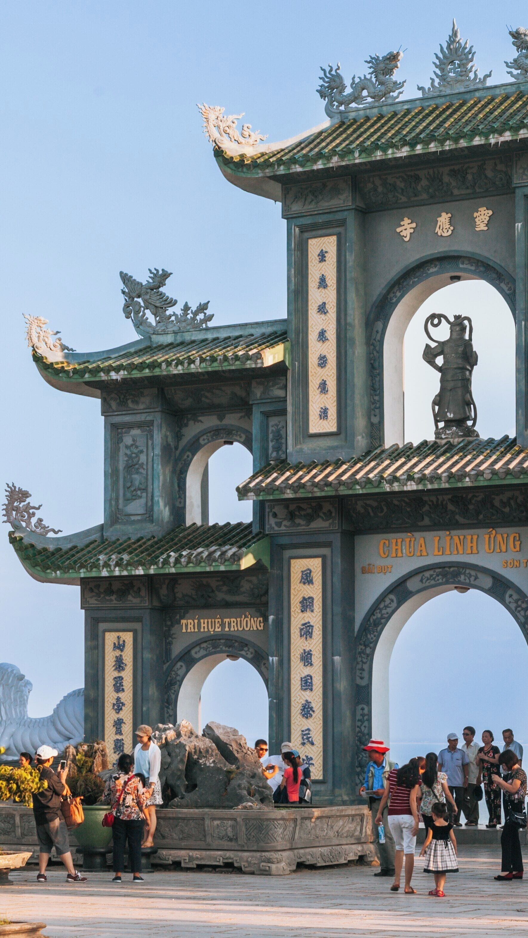 Exploring Linh Ung Pagoda at Son Tra Mountain in Da Nang, Vietnam during a vibrant day filled with visitors and scenic beauty