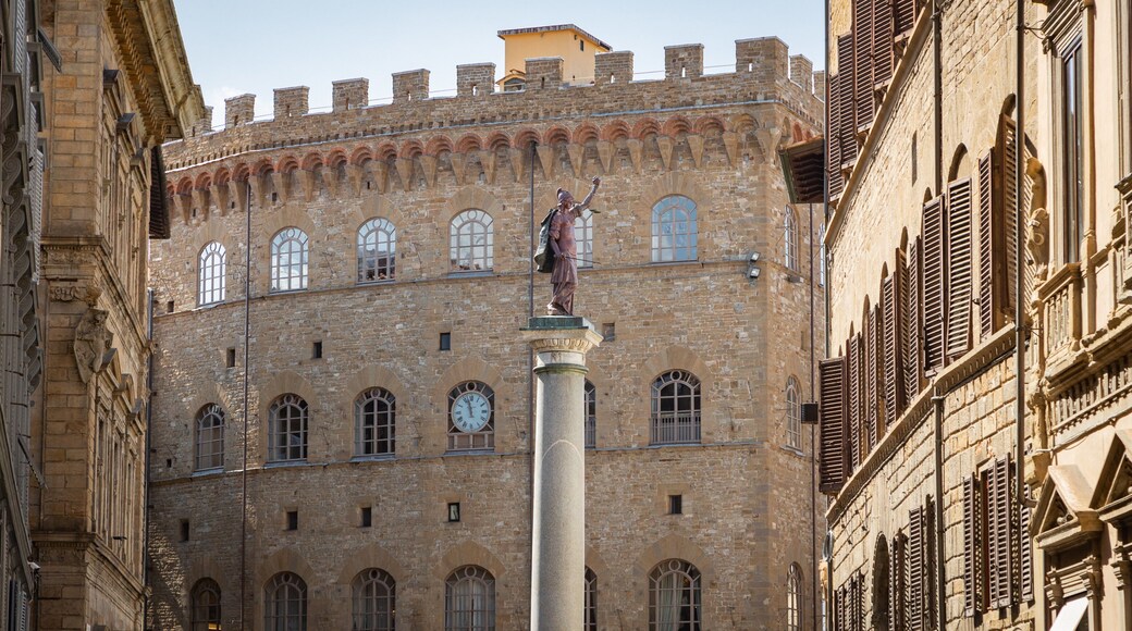 Via de\' Tornabuoni which includes heritage architecture and a statue or sculpture