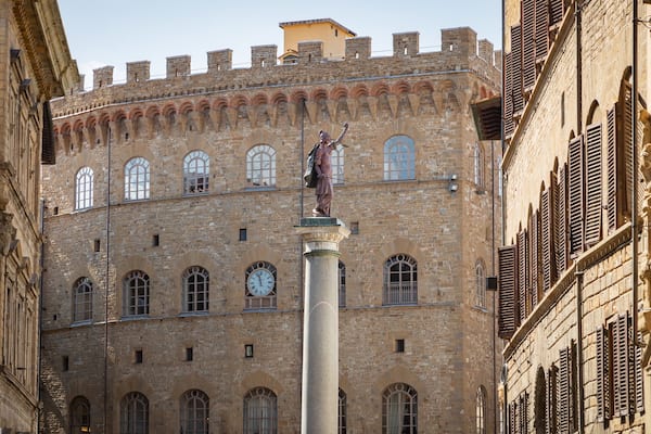 Via de\' Tornabuoni which includes heritage architecture and a statue or sculpture