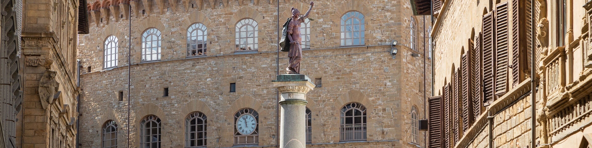 Via de\' Tornabuoni which includes heritage architecture and a statue or sculpture