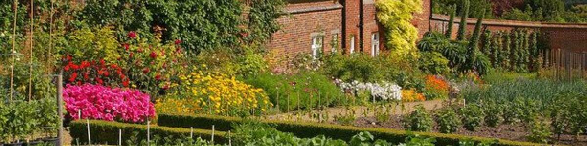 Cottage in Walled Garden, Titsey Place The Walled Garden was completely restored in 1996. The cottage is grade II listed, and dates from 1868 to a design by George Devey.