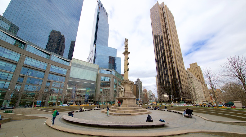 Columbus Circle featuring a city, a high rise building and a statue or sculpture