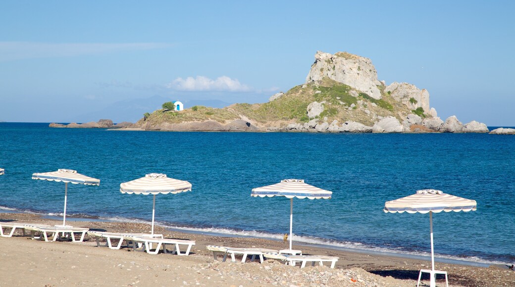 Kefalos featuring a pebble beach and island images