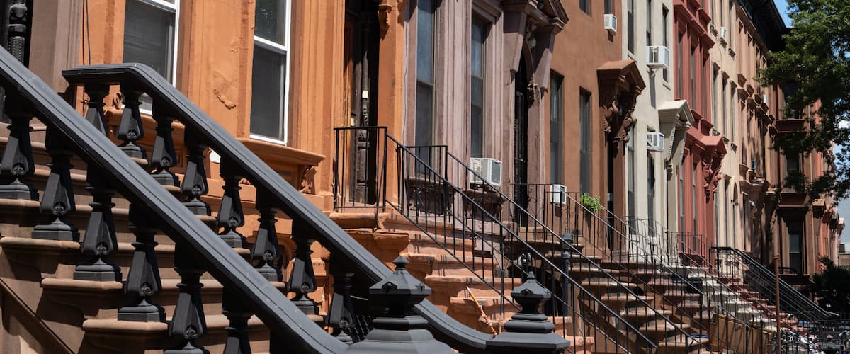 Row of Old Brownstone Homes in Bedford-Stuyvesant in Brooklyn of New York City with Staircases