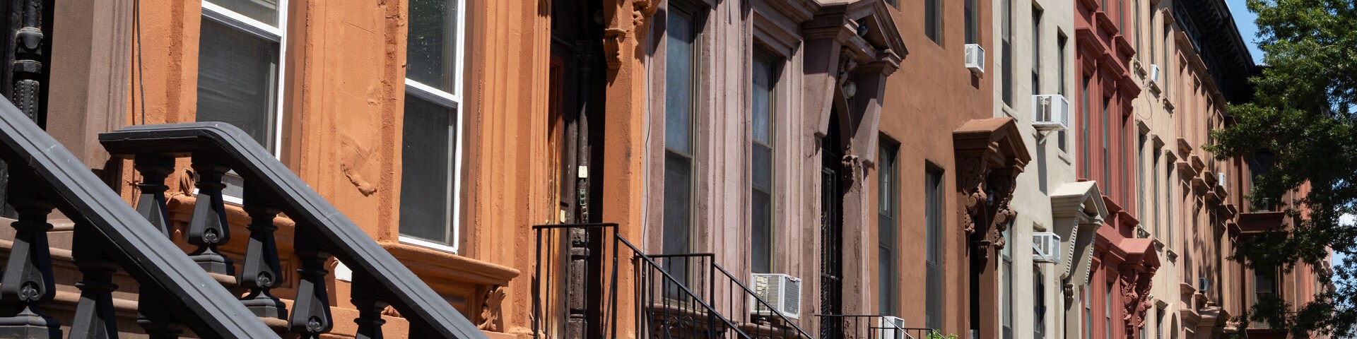 Row of Old Brownstone Homes in Bedford-Stuyvesant in Brooklyn of New York City with Staircases