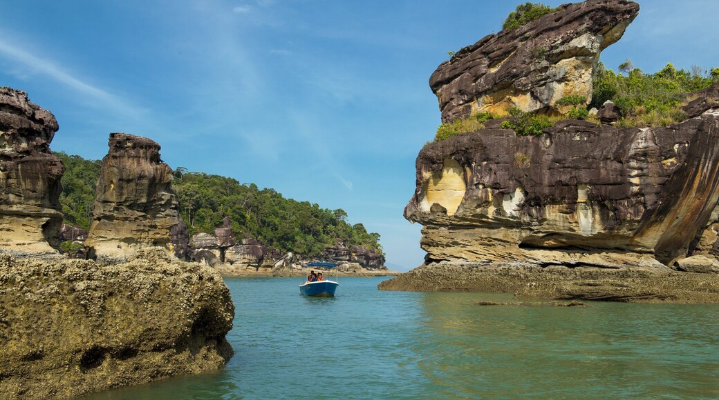 Kuching showing a river or creek, boating and rocky coastline