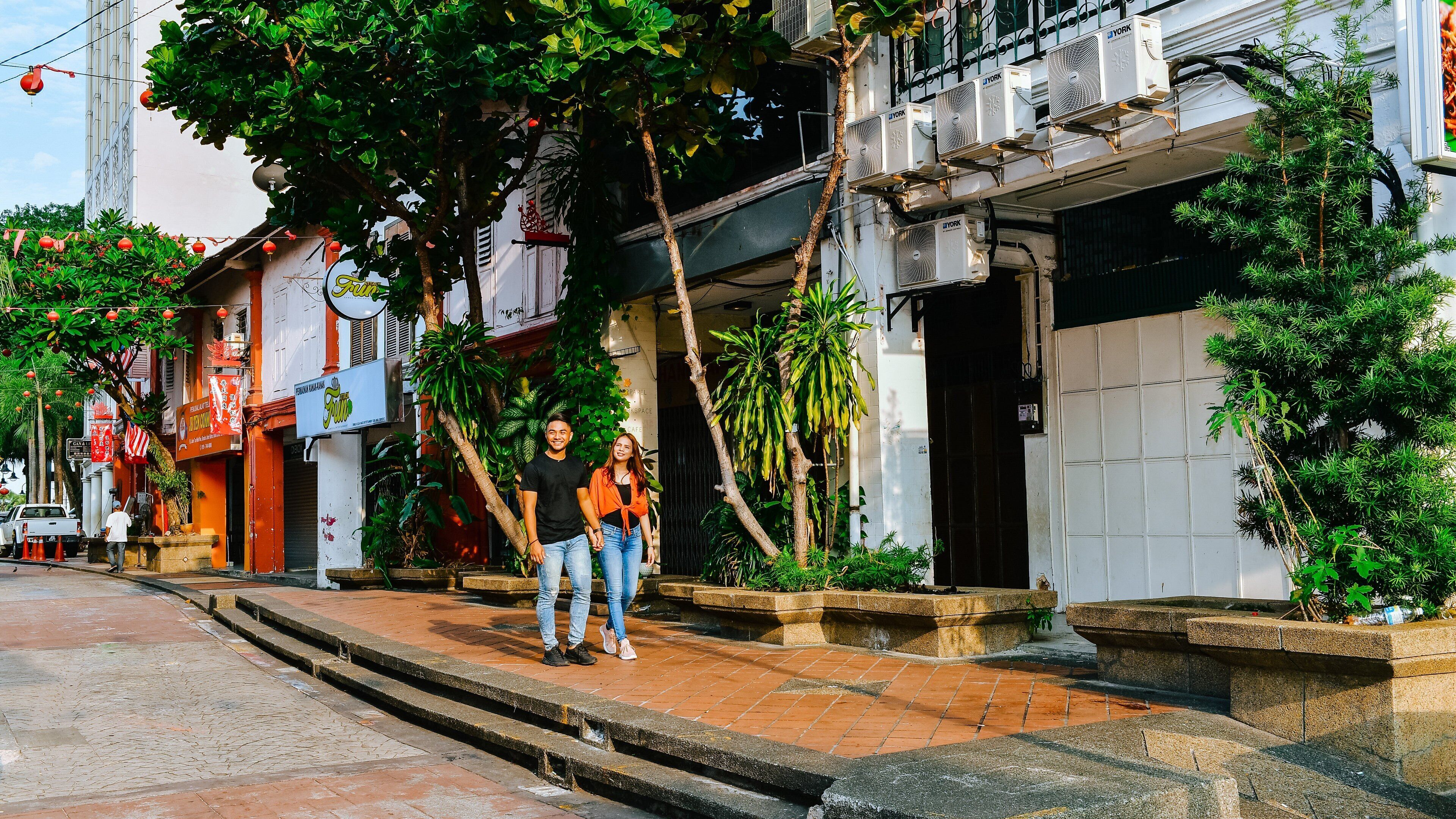 Johor Bahru showing street scenes as well as a couple