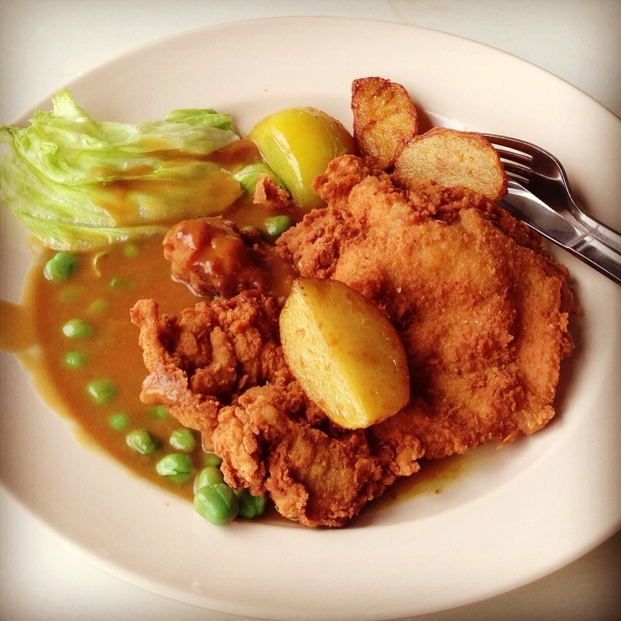 Authentic Hainanese Chicken Chop since 1946. Try also the toast bread and local coffee