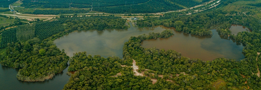 Aerial drone view of tropical scenery with dam lake at Jasin, Melaka, Malaysia