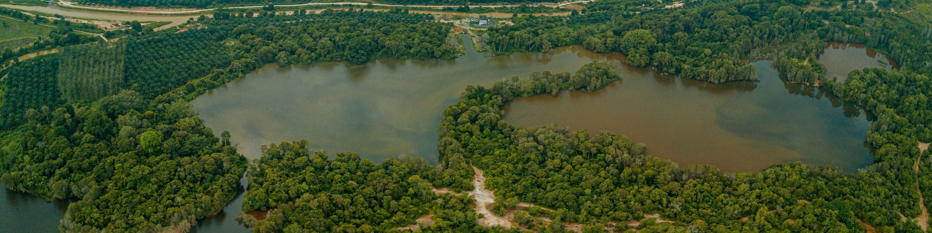 Aerial drone view of tropical scenery with dam lake at Jasin, Melaka, Malaysia