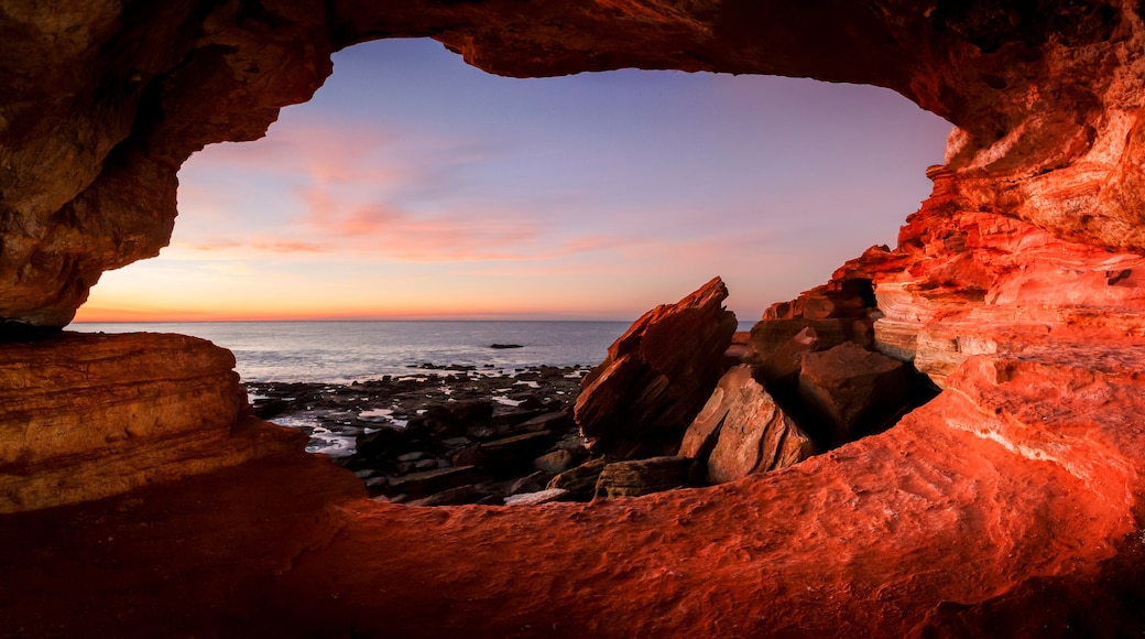 Looking out from a small cave at Gantheaume Point Broome Western Australia at sunset