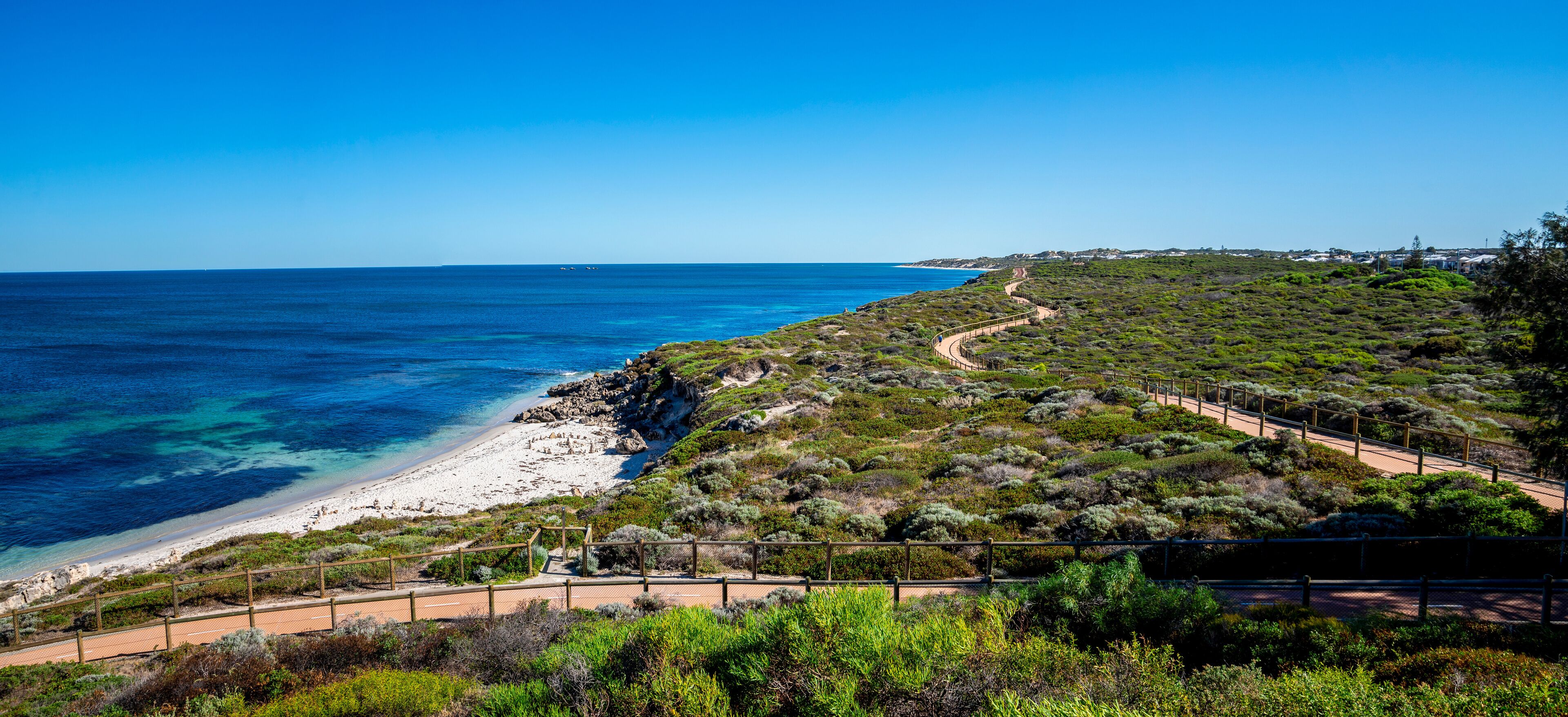 Panoramic View of Coastal Trail Along Scenic Shoreline from Iluka to Burns Beach with Clear Blue Sea and Vibrant Greenery, Perth, Australia, March 2020
