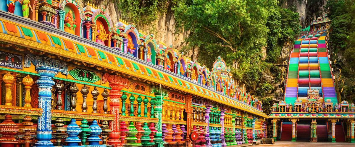 A colorful temple with intricate carvings and statues.