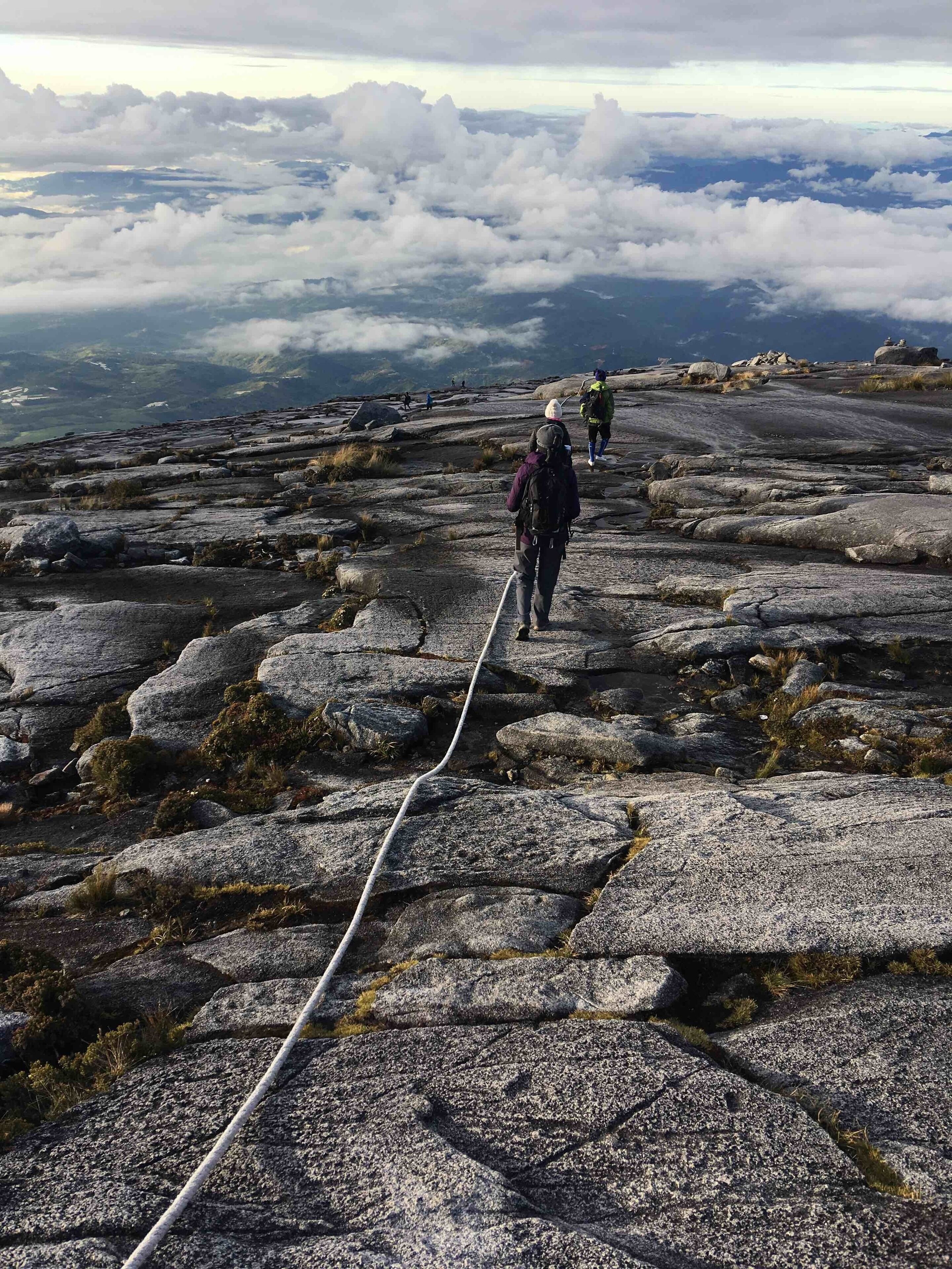 Descending from the summit of Mount Kinabalu shortly after sunrise.