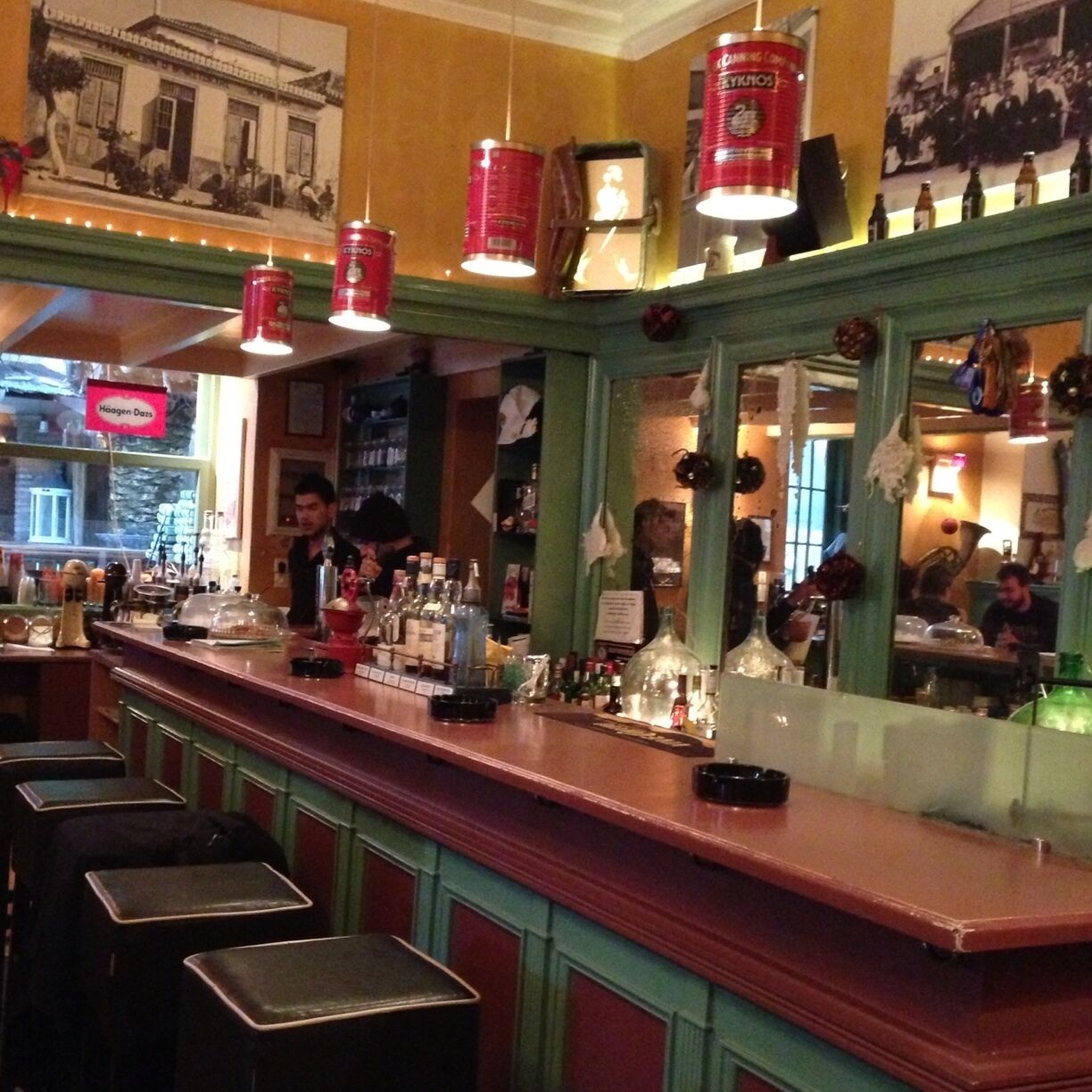 An artistic cafe-bar to enjoy your drink. Notice the tomato paste tins used as lights above the bar