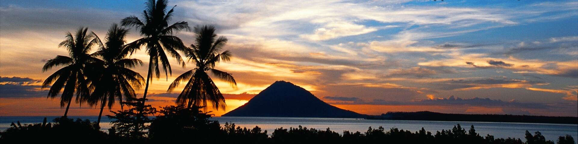 Manado showing a sunset, tropical scenes and general coastal views