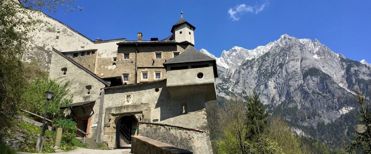 The entrance to Hohenwerfen Fortress in Werfen, Austria. The fortress has a fascinating history, incredible views of the valley, and a fun bird show. We really enjoyed the hike up to it as well.
