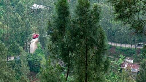 The winding road above the mountains can be seen passing vehicles at Bromo Pasuruan