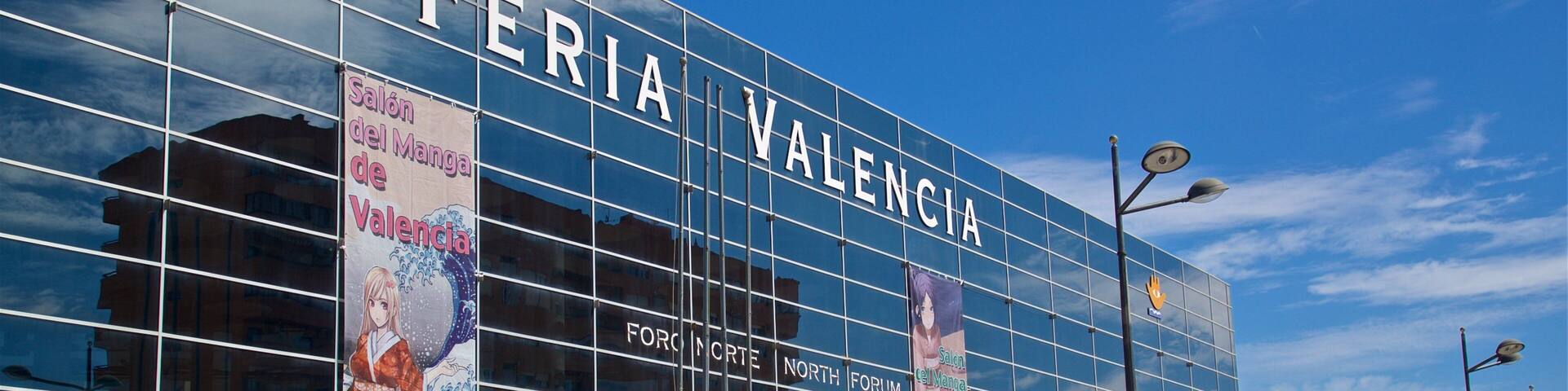 A modern building with the name 'FERIA VALENCIA' prominently displayed.