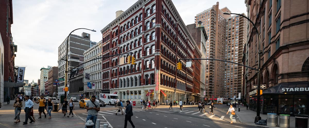 East Village showing street scenes, a sunset and a city