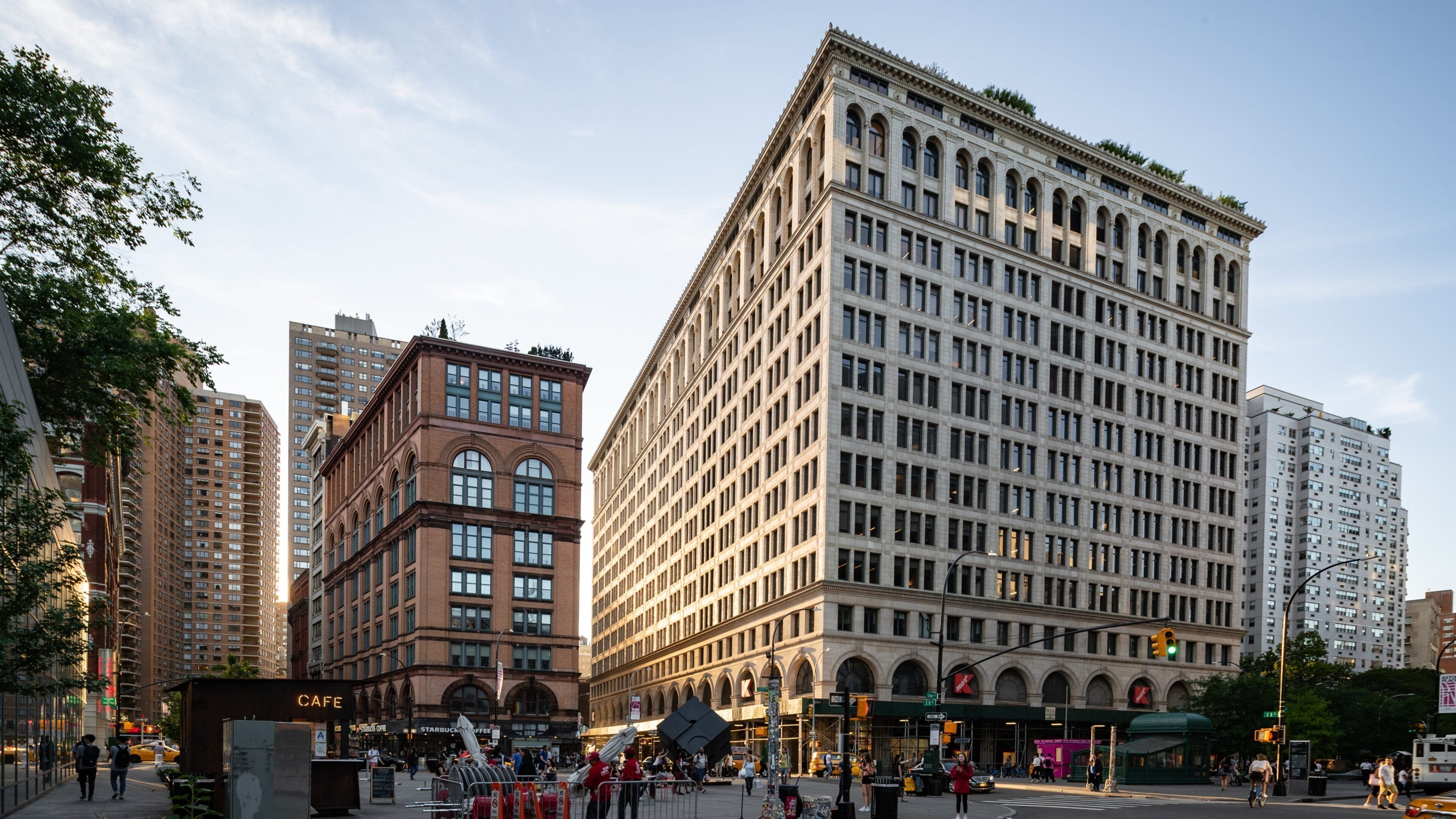 East Village which includes street scenes, a sunset and a city