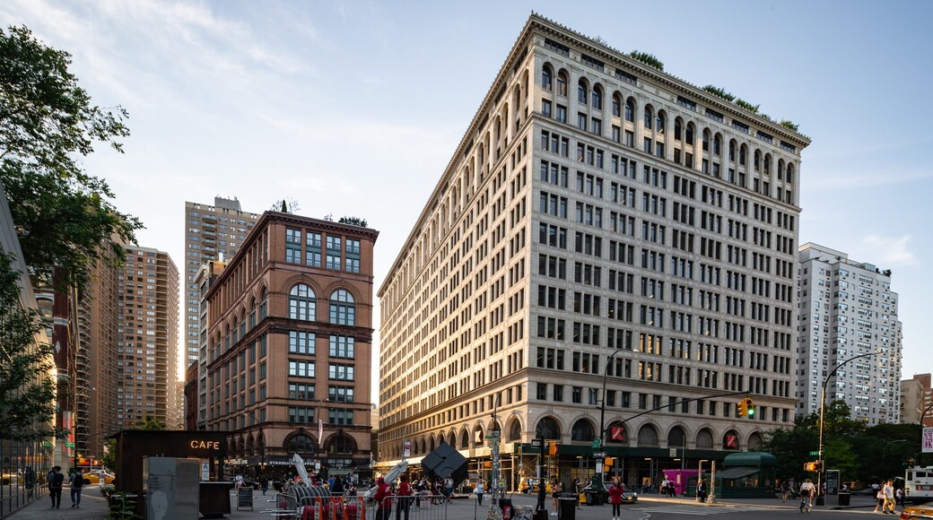 East Village which includes street scenes, a sunset and a city