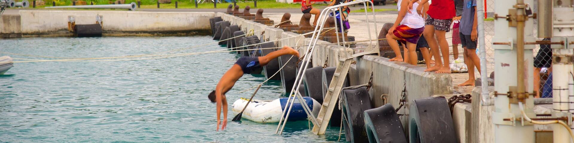 Avarua which includes swimming as well as a small group of people