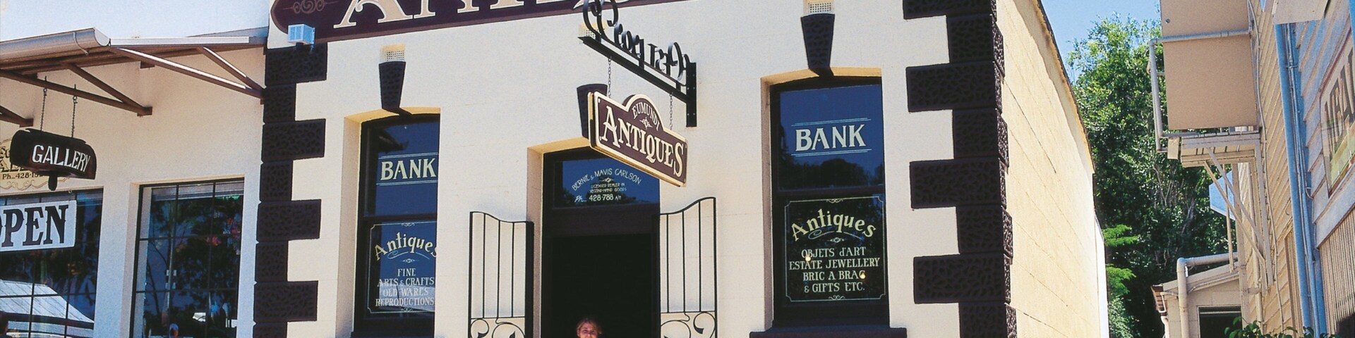 Eumundi featuring heritage elements and signage as well as an individual femail