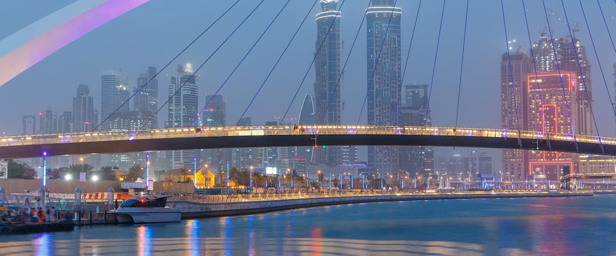 Pedestrian Bridge over the Dubai Water Canal day to night timelapse, United Arab Emirates