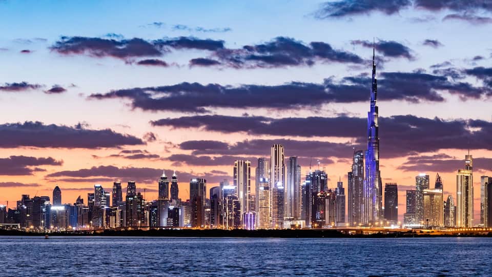 Skyscrapers skyline of Dubai UAE downtown with Burj Khalifa at sunset