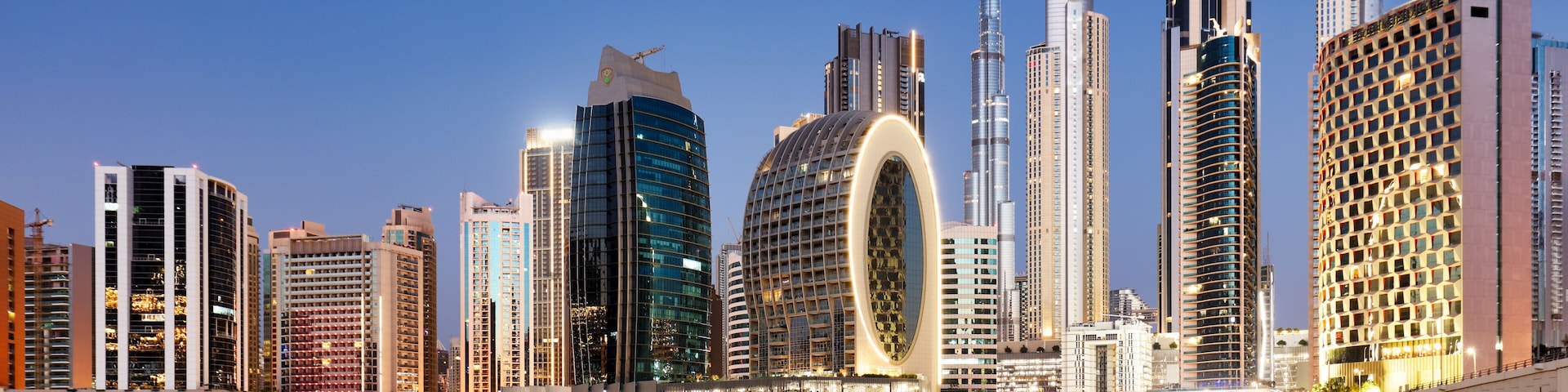 Panaroma of Dubai skyline with Burj khalifa and other skyscrapers at night from Al Jadaf Waterfront; UAE