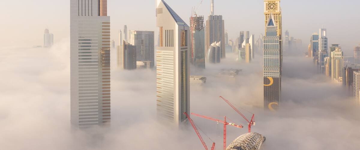 Aerial view of buildings surrounded by clouds, Trade Center 2, Dubai, United Arab Emirates