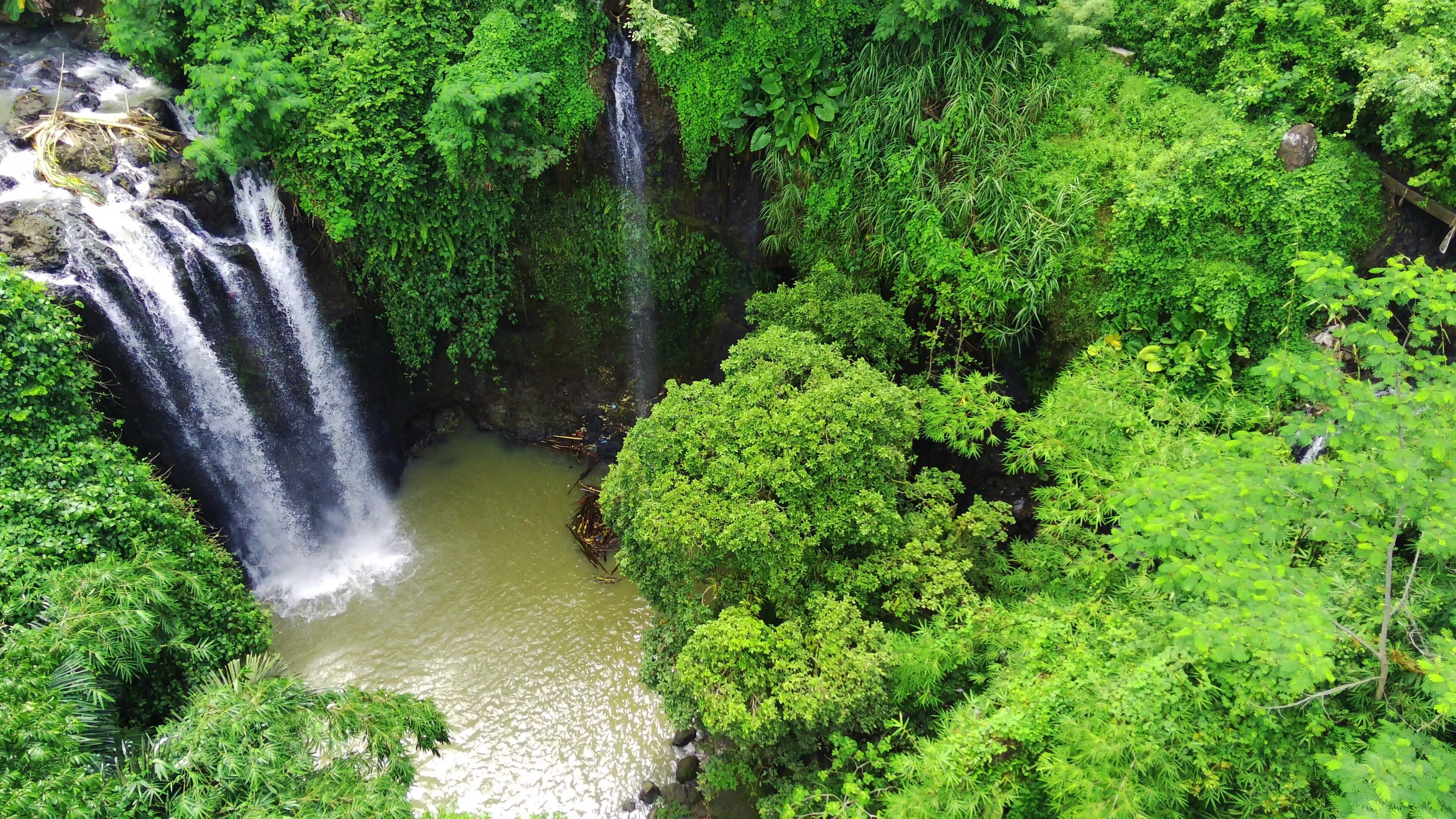 the natural freshness of the Curug or waterfalls Gondoroiyo in Semarang. Indonesia. Long Exposure photography.