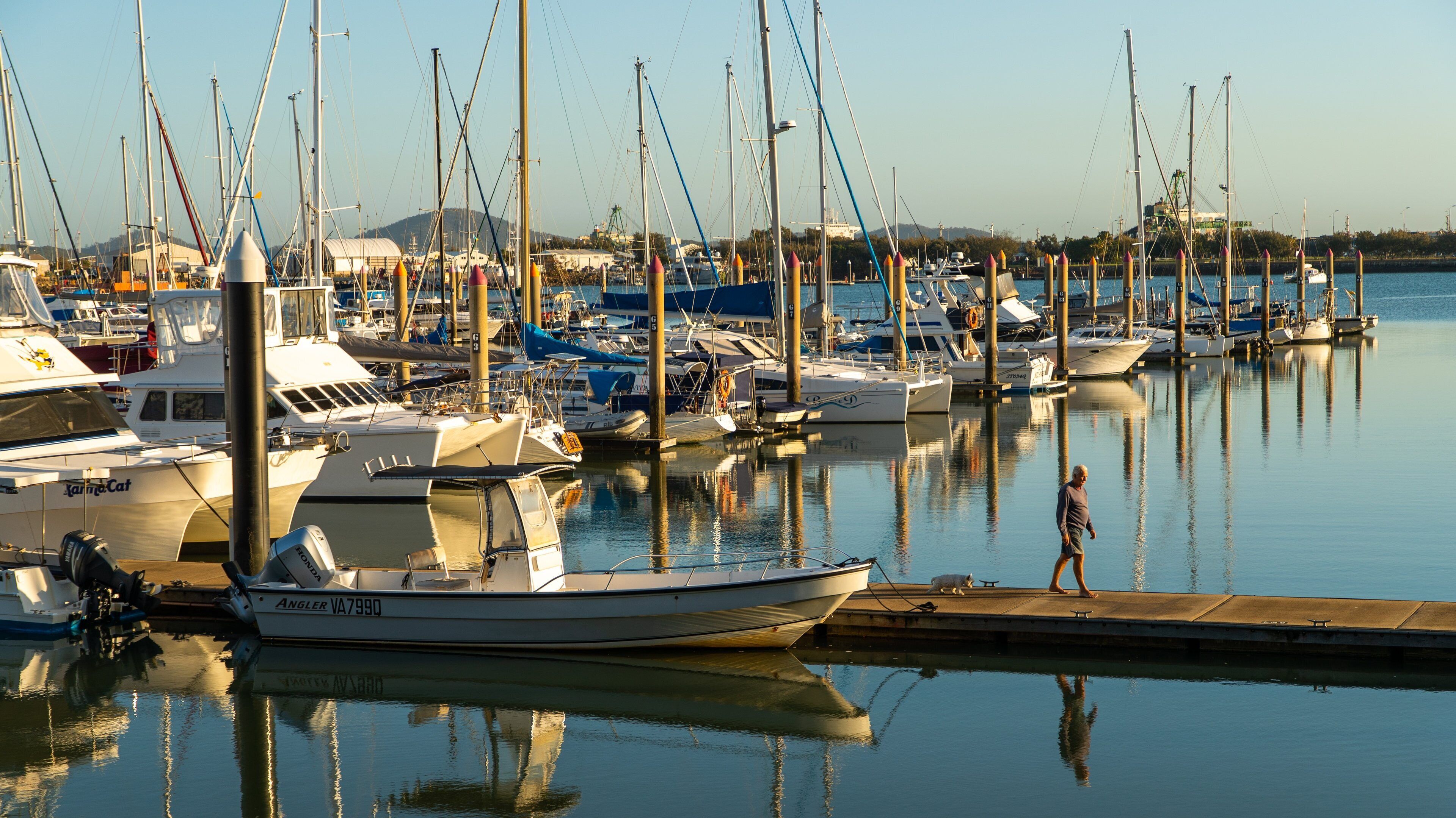 Callemondah which includes a bay or harbor and a sunset as well as an individual male
