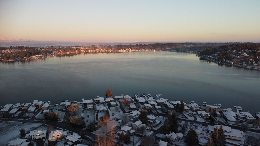 Aerial drone view of the eastside of Lake Stevens at sunset in winter
