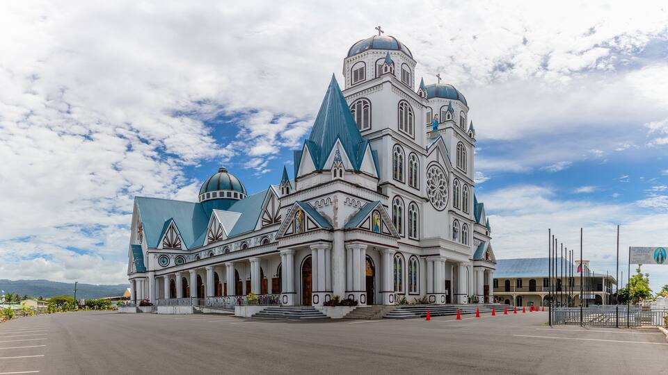 A large, ornate church with multiple domes and spires.