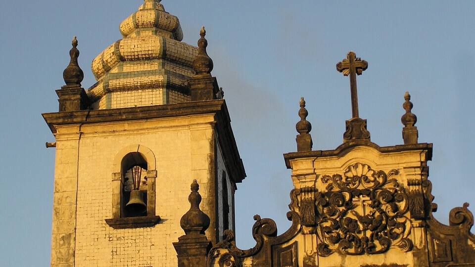 A historic church with a bell tower and ornate facade.