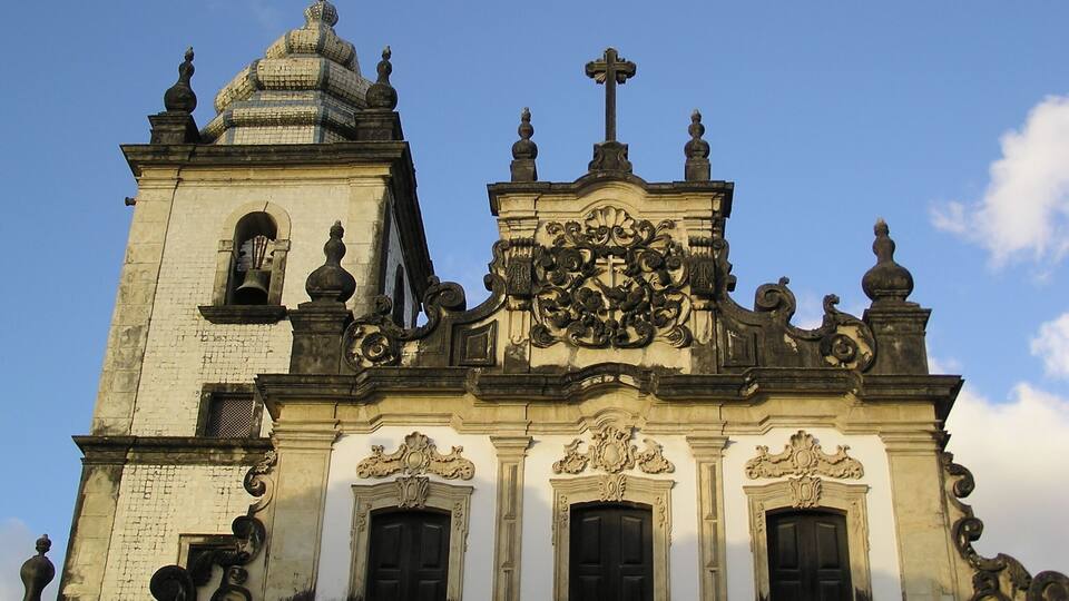 A historic church with ornate architecture, including a bell tower and detailed carvings.