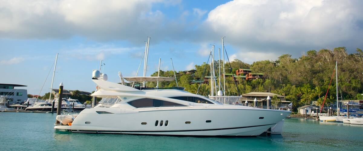 Hamilton Island Marina showing tropical scenes, a bay or harbor and sailing