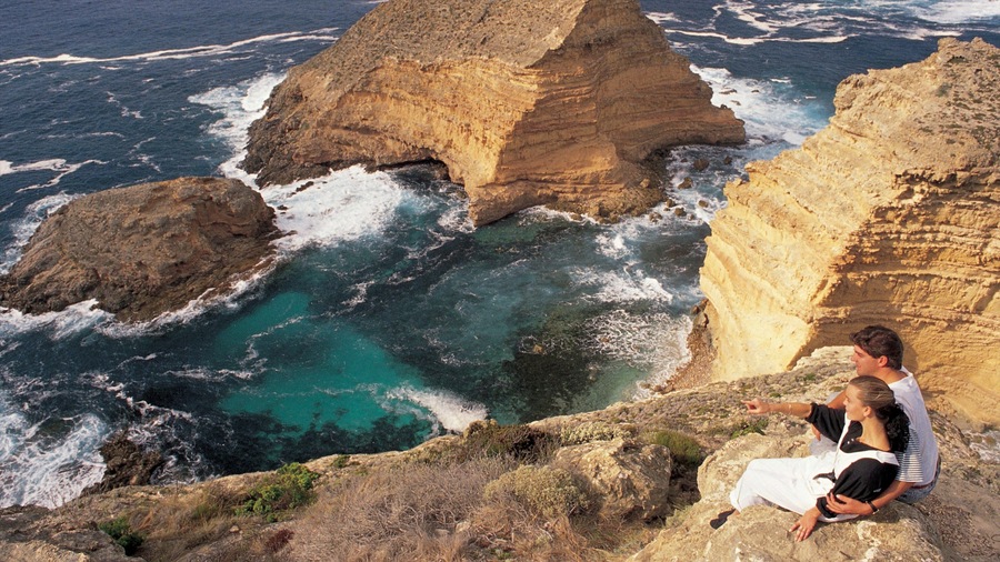 Port Lincoln featuring landscape views and rocky coastline as well as a couple