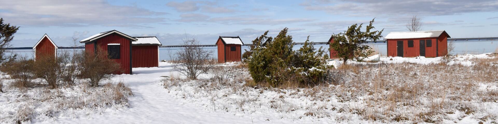 Old fishing cabins in winter season by Farjestaden at the swedish island Oland; Shutterstock ID 1327961756; Purchase Order: -