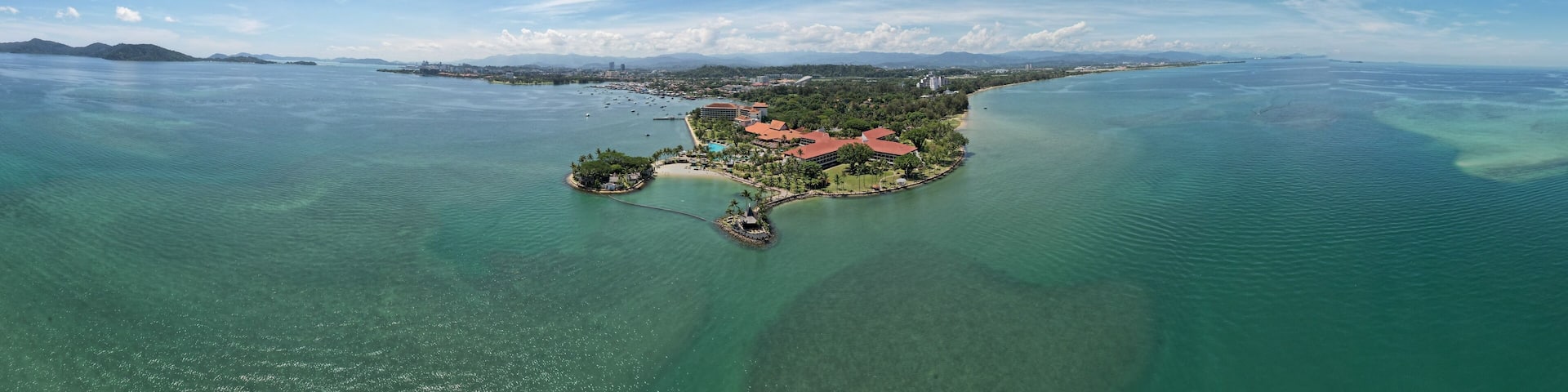 Kota Kinabalu, Sabah Malaysia – June 15, 2022: The Tanjung Aru Beach, Fisherman Village and Shangri-La Hotel