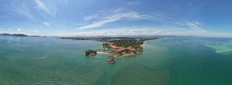 Kota Kinabalu, Sabah Malaysia – June 15, 2022: The Tanjung Aru Beach, Fisherman Village and Shangri-La Hotel