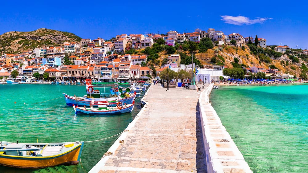 Traditional colorful Greece - travel in beautiful Samos Island, scenic Pythagoion town. view with traditional boats