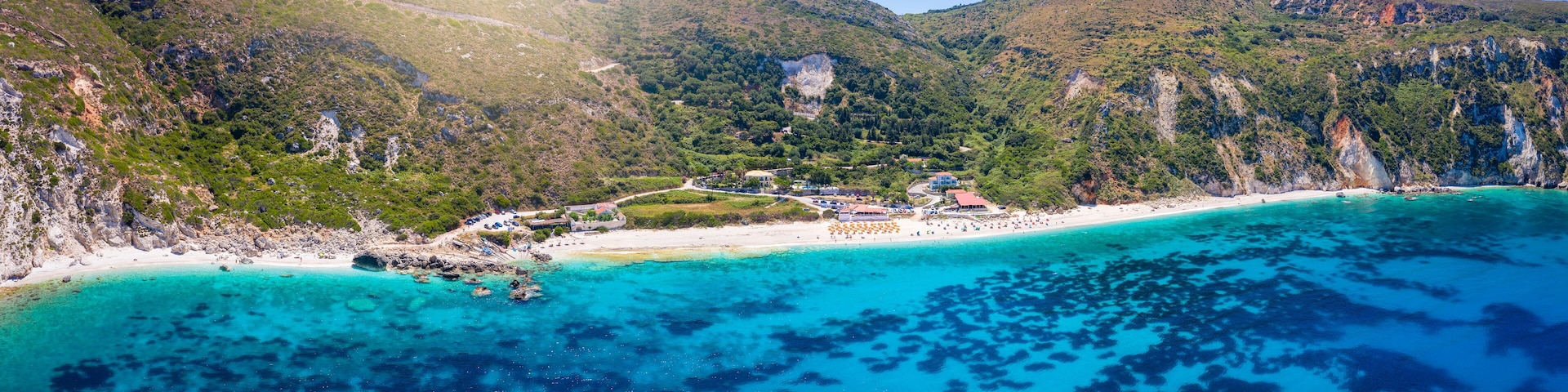 Panoramic view of the popular Petani Beach, Kefalonia Island, Greece, with turquoise sea and sunshine in summer time