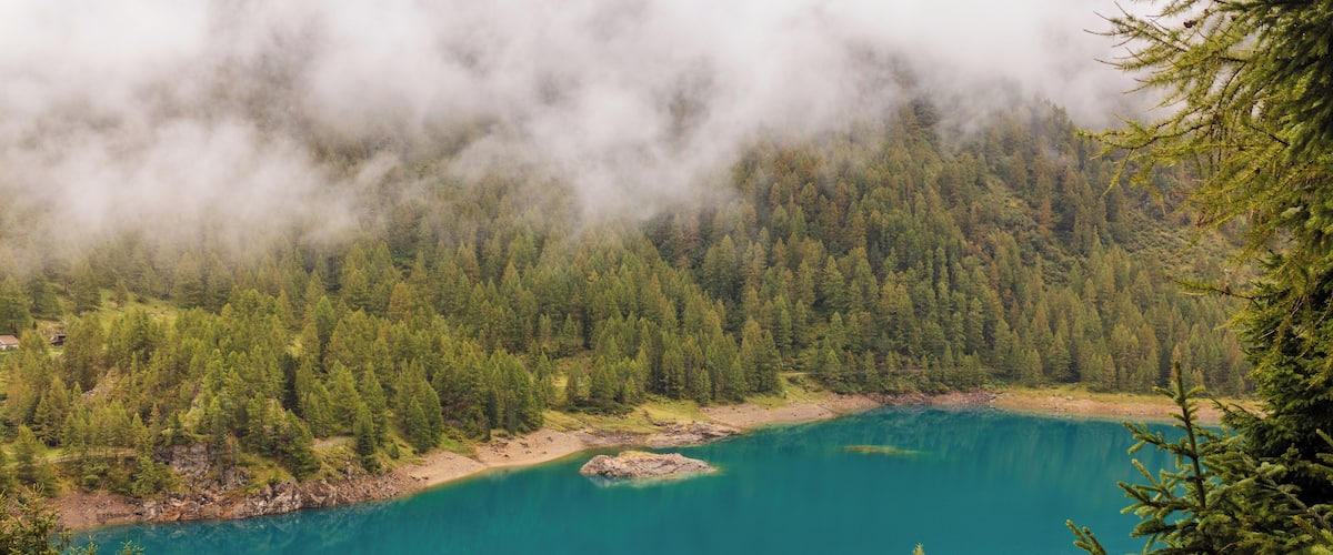 Walking around Lago di Pian PalĂč (1800 m). in the Parco nazionale dello Stelvio (Italy).