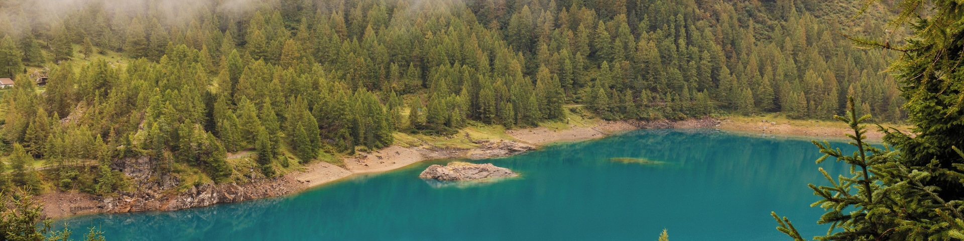 Walking around Lago di Pian Palù (1800 m). in the Parco nazionale dello Stelvio (Italy).