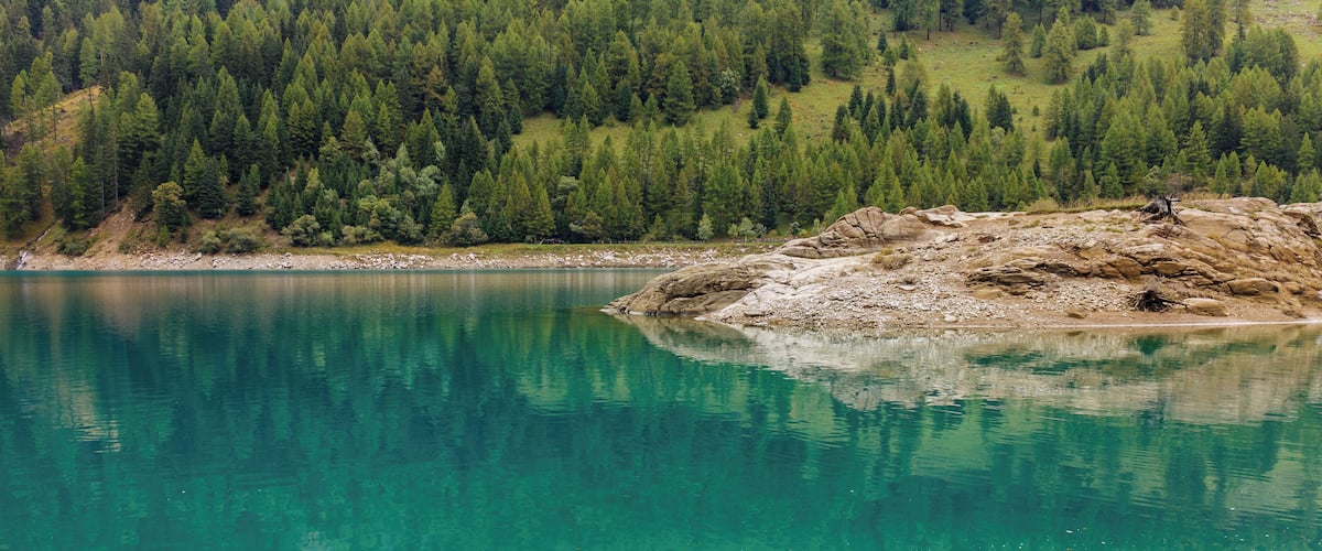 Walking around Lago di Pian Palù (1800 m). in the Parco nazionale dello Stelvio (Italy).